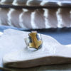 brass and silver mjolnir ring