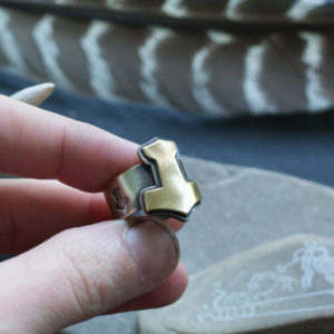 brass and silver mjolnir ring