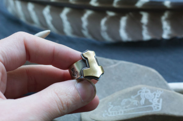 brass and silver mjolnir ring