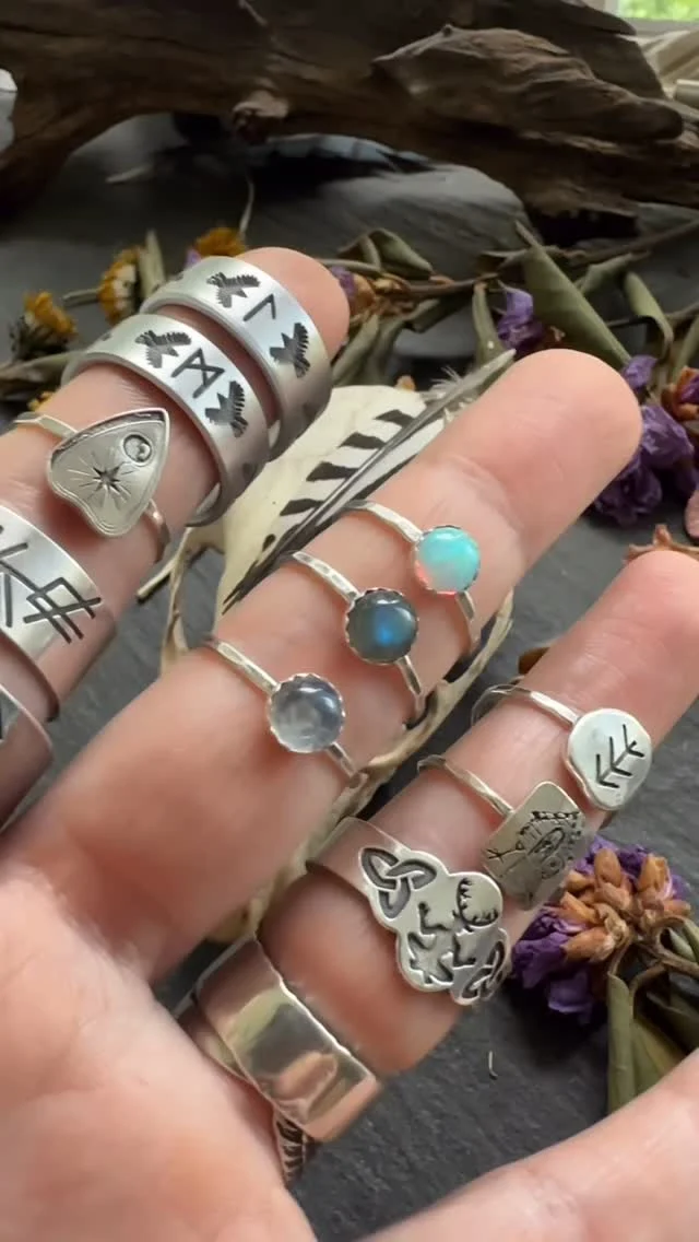 This morning’s little gathering before they head off to their owners. ✨

Gemstone rings, rune rings, raven branch rings, a planchette ring, Cernunnos, Baba Yaga, Vinca symbols, a custom bind rune, Loki, Witch Bitch, a Vegvísir and labradorite clam shell locket, and a petroglyph bracelet are all getting packed up and sent on their way.

I always love seeing the mix of pieces that leave the studio together. A little folklore, a little witchcraft, a little old-world magic, and a whole lot of “this was made for someone very specific.”

Thank you for keeping my hands busy and my bench full. 🖤
