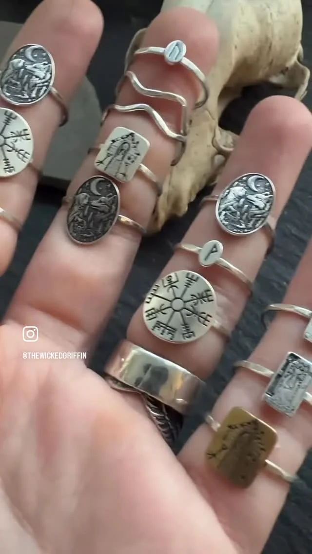 🌙 Keeper of secrets, veil of night, guide me through the hidden rite.

Items shown handmade to order via my website + Etsy shop:

🌗 Sword Earrings, Loki Pendant, Solitary Witch Ring

🌘 Rings: Baba Yaga Hut, Tarot Cards, Red Riding Hood, Vegvisir, Tiny Runes + Squiggly Stack

🌑 Copper 24 Rune Bracelet, Custom Theban Bracelet